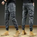 Men's retro dark grey cargo jogger pants with multiple pockets and elastic tapered cuffs - 29 / Bottoms / Gray