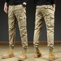 Vintage men's khaki cargo joggers featuring multiple pockets and elastic cuffs for comfort - 29 / Bottoms / Khaki
