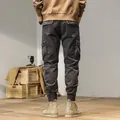 Men's vintage dark grey cargo jogger pants featuring multi-pocket design and back view - 28 / Bottoms / Gray