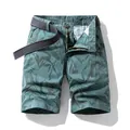 Trendy men's cargo shorts featuring a teal leaf pattern and adjustable grey belt - 38 / Bottoms / Dark Blue