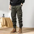 Men's olive green fleece-lined cargo pants with multiple pockets and elastic cuffs - 28 / Bottoms / Army Green
