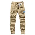 Men's stylish khaki cargo pants featuring multiple pockets and functional cuffed ankles. - 28 / Bottoms / Khaki