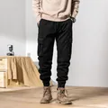 Black fleece-lined men's winter cargo pants with multi-pockets and cuffed ankles - 28 / Bottoms / Black