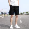 Men's black casual cargo shorts with drawstring waist for a summer outdoor style. - Black
