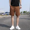 Men's vintage brown cargo shorts featuring a loose casual fit for summer outdoor wear - 29 / Bottoms / Coffee