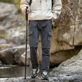Durable men's dark grey gorpcore cargo pants featuring multi-pockets and a drawstring waist - 29 / Bottoms / Gray
