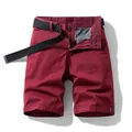 Classic men's burgundy cargo shorts featuring a black woven belt for a retro summer look. - Burgundy