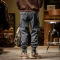 Back view of grey American vintage cargo pants featuring large side pockets and joggers - 28 / Bottoms / Gray