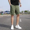 Relaxed fit olive green cargo shorts for men featuring vintage Japanese street style - 28 / Bottoms / Army Green