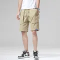 Men's loose khaki cargo shorts with multi-pockets and drawstring waist for summer. - 28 / Bottoms / Khaki