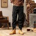 Men's vintage black multi-pocket tapered cargo pants for outdoor street style - 28 / Bottoms / Black