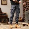 Men's street-style multi-pocket elastic cuff cargo pants in dark grey SKU view. - 28 / Bottoms / Gray