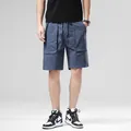 Casual men's blue cargo shorts featuring a loose fit and drawstring waist for summer wear - Dark Blue