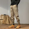 Men's khaki cargo jogger pants with elastic waist and utilitarian multi-pocket design - 28 / Bottoms / Khaki