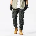 Men's camouflage cargo pants with tapered cuffs and multiple pockets for outdoor sports - 29 / Bottoms / Army Green