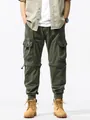 Vintage olijfgroene functionele cargo broek voor heren met zakken en jogger boorden - 40 / Bottoms / Legergroen