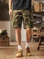Men's loose fit camouflage cargo shorts with multiple pockets in a vintage studio setting - 30 / Bottoms / Khaki Camouflage