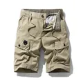 Premium men's khaki cargo shorts featuring multiple utility pockets and elastic waist - 30 / Bottoms / Khaki