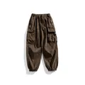 Men's brown techwear cargo pants featuring a multi-pocket design and elastic drawstring waist. - 2XL / Bottoms / Brown