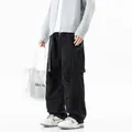Men's black multi-pocket cargo pants with a loose straight fit for outdoor mountain style. - S / Bottoms / Black