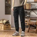 Retro black functional cargo pants with multiple pockets and cuffed ankles - 28 / Bottoms / Black