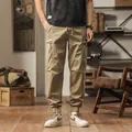 Men's vintage khaki cargo joggers featuring multi-pocket design and elastic cuffs - 28 / Bottoms / Khaki