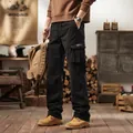Men's black American vintage multi-pocket cargo pants shown in a rustic studio setting - 29 / Bottoms / Black