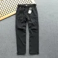 Close-up of black quick-dry cargo pants with multi-pockets and adjustable belt. - S [90-110 Jin] / Bottoms / Summer Thin Black