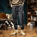 Dark grey fleece-lined cargo pants for men with multi-pockets and cuffed ankles - 28 / Bottoms / Grey Fleece-lined