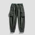 Men's dark green cargo pants with multi-pockets and ankle zippers for outdoor wear. - 28 / Bottoms / Thick Army Green