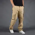 Detailed side view of men's khaki cargo pants featuring large functional side pockets - 29 / Bottoms / Khaki