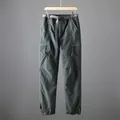 Detail view of men's quick-dry tactical cargo pants with belt on a wooden hanger - 2XL (80-90kg) / Bottoms / Spring/Autumn Medium Thick Dark Gray