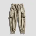 Vielseitige khaki Cargohose mit mehreren Taschen Tunnelzug und Reißverschluss am Knöchel - 28 / Unterteile / Khaki Gepolstert
