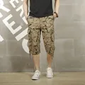 Men's casual khaki cargo shorts featuring a black graffiti print and multi-pocket design - 28 / Bottoms / Khaki