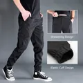 Black multi-pocket cargo pants for men with drawstring waist and elastic cuffs detail - M / Bottoms / Black