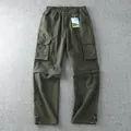 Detail view of army green convertible cargo pants with multiple utility pockets - M / Bottoms / Army Green