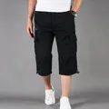 Vista detallada de los pantalones cargo 3/4 de algodón negro casual para hombre con bolsillos - M / Bottoms / Negro