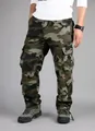 Detail view of men's loose-fit green camouflage cargo pants with multiple pockets - 38 / Green Camouflage (Bottom)