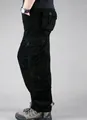 Side view of durable men's black cotton cargo pants featuring a multi-pocket design - 29 / Bottoms / 8-Pocket Style / Black