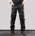 Detailed view of men's durable black camouflage multi-pocket cargo pants outdoors - 38 / Black Camouflage (Bottom)