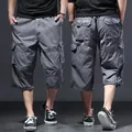 Comfortable loose grey men's three-quarter cargo shorts with multi-pocket utility design - S / Bottoms / Dark Gray