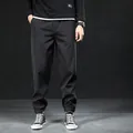 Pantalon de jogging noir doublé polaire pour homme avec chevilles élastiques - M / Bas / Doublé Polaire d'Hiver / Noir