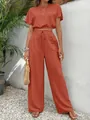 Elegant two-piece set featuring a terracotta crop top and matching wide-leg trousers. - S / Top And Bottom / Watermelon red