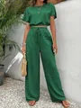 Elegant green two-piece set featuring textured cropped top and wide-leg trousers. - S / Top And Bottom / Green