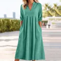 Front view of a casual green cotton-linen V-neck midi dress with pockets for summer wear - S / Green