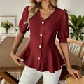 Detail of elegant burgundy V-neck blouse featuring puff sleeves and gold buttons - Burgundy