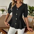 Close-up of elegant black puff sleeve V-neck peplum blouse showing fit and gold buttons - S / Tops / Black