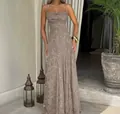 Detailed visual shot of a taupe floral textured slip maxi dress with thin straps. - Gray