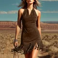 Close-up of a vintage brown suede mini dress featuring long fringe hem in a desert setting. - S / Top And Bottom / Brown