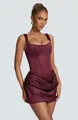 Detail of burgundy satin mini dress featuring a square neck and draped corset design. - Fuschia